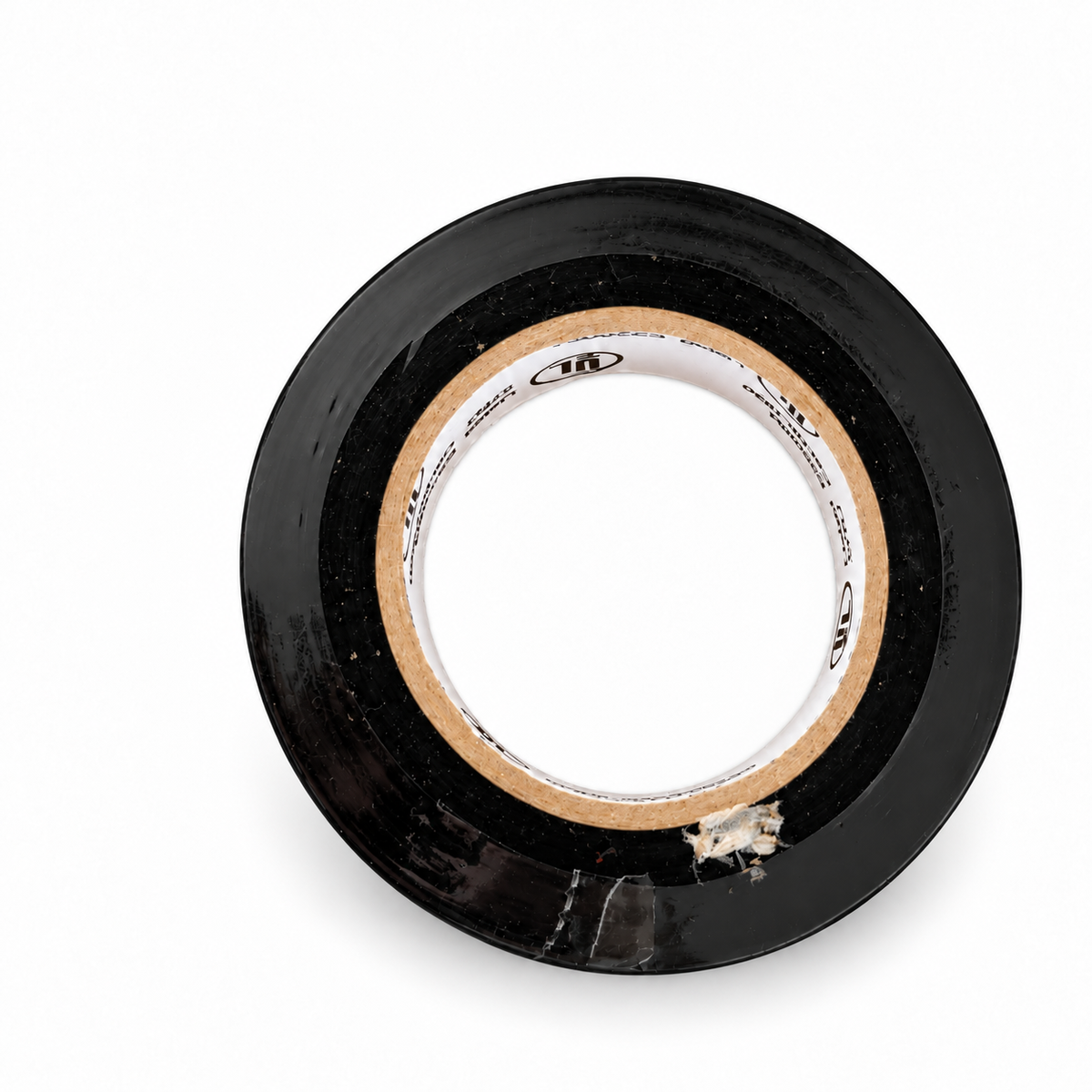 Black electrical tape roll with open cardboard core on white