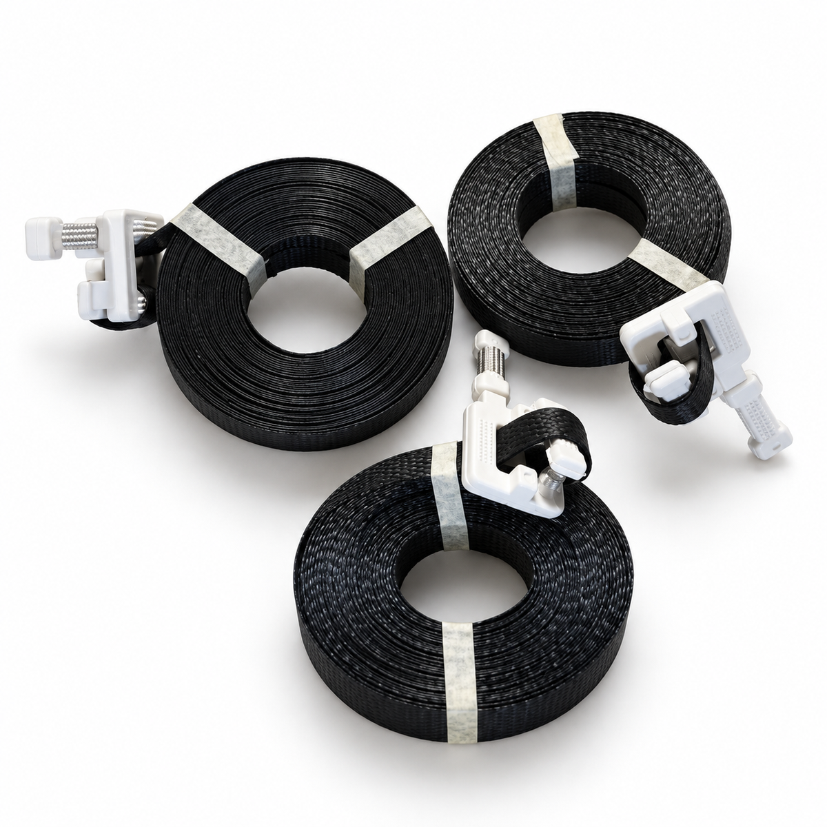 Three sample coils of black precut banding with buckles on white background