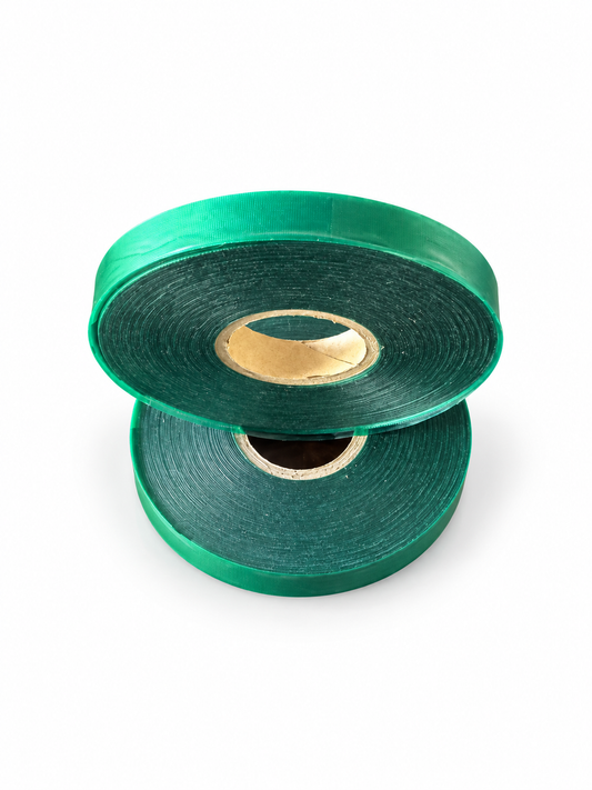 Two green Tie-It machine tie tape rolls, 1/2 inch x 200 ft, on white background